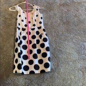 Black and whit polka dot dress with pink belt